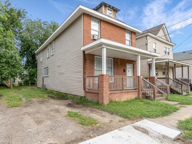 view of front of home featuring cooling unit and covered porch