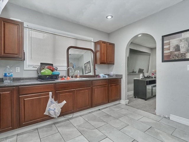 kitchen featuring sink and light tile patterned floors