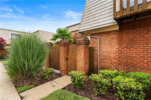 view of gate with fence