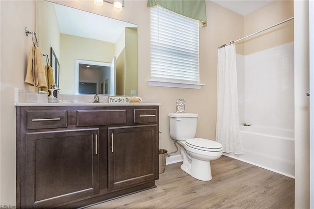 full bathroom with toilet, vanity, shower / bathtub combination with curtain, and wood-type flooring