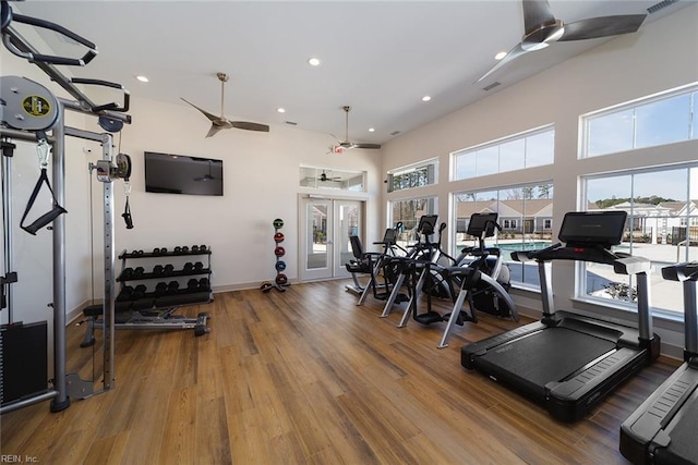 exercise room featuring ceiling fan, hardwood / wood-style flooring, and french doors