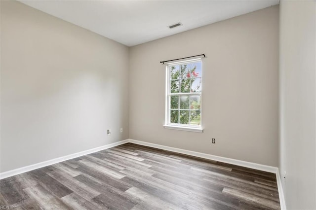 unfurnished room featuring wood-type flooring