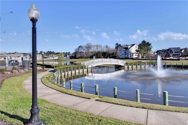 surrounding community with a water view