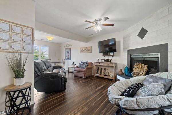 living room featuring hardwood / wood-style flooring and ceiling fan