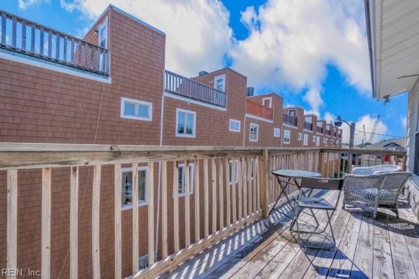 wooden balcony featuring a deck