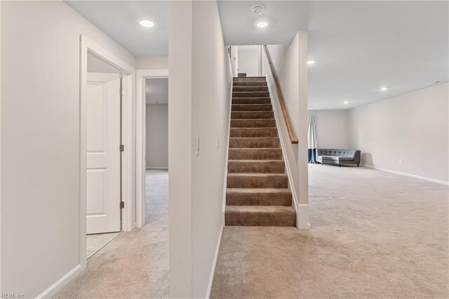 interior space featuring light colored carpet