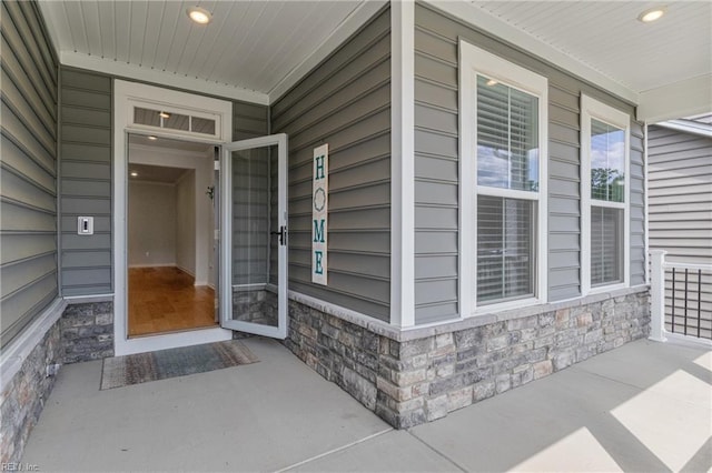 doorway to property with a porch