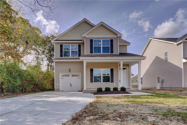 craftsman inspired home with concrete driveway, an attached garage, and a porch