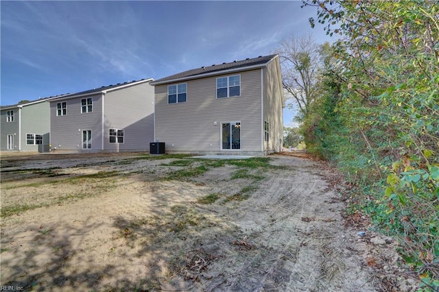 rear view of property featuring central air condition unit