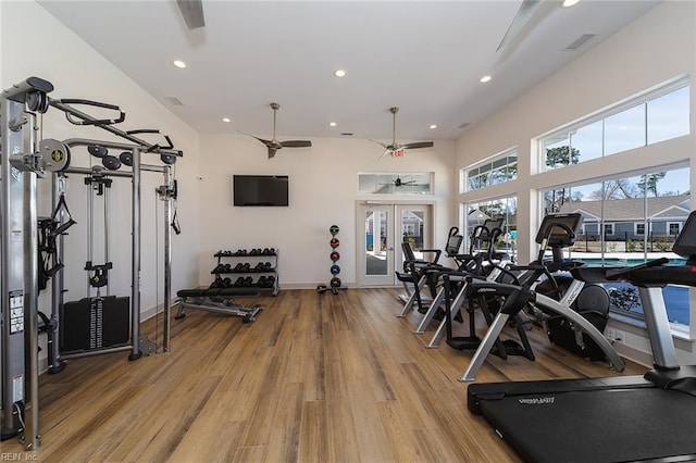 workout area with ceiling fan, hardwood / wood-style floors, and french doors