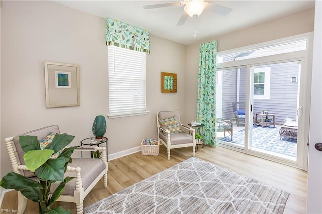 sitting room featuring light hardwood / wood-style flooring and ceiling fan