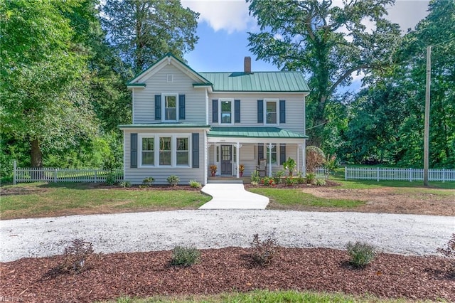 view of property featuring covered porch