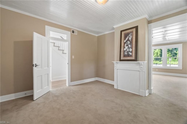 carpeted empty room with ornamental molding