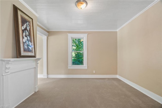 carpeted spare room with ornamental molding