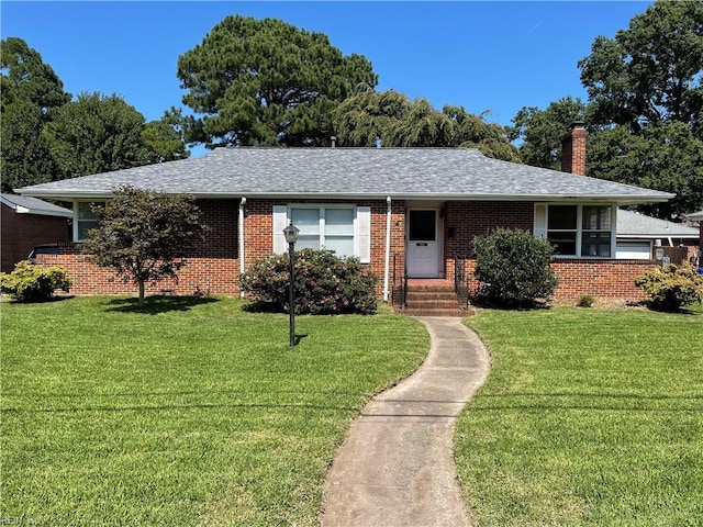 ranch-style home with a front lawn