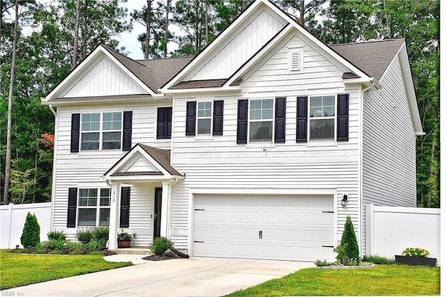 view of front of property featuring a garage, concrete driveway, board and batten siding, and fence