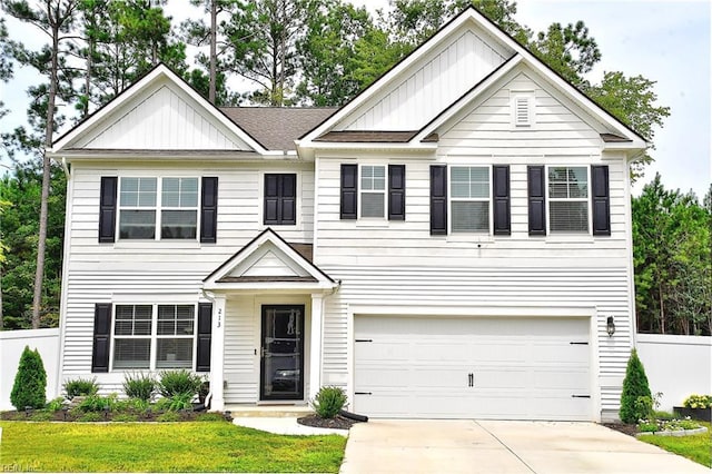 view of front of home featuring board and batten siding, concrete driveway, fence, and a garage