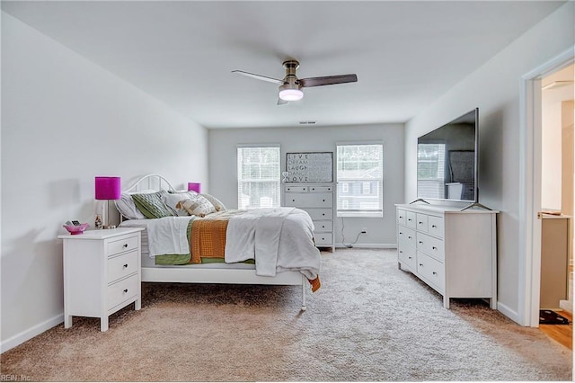 bedroom featuring ceiling fan and light colored carpet