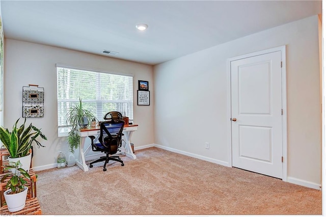 carpeted home office featuring baseboards and visible vents