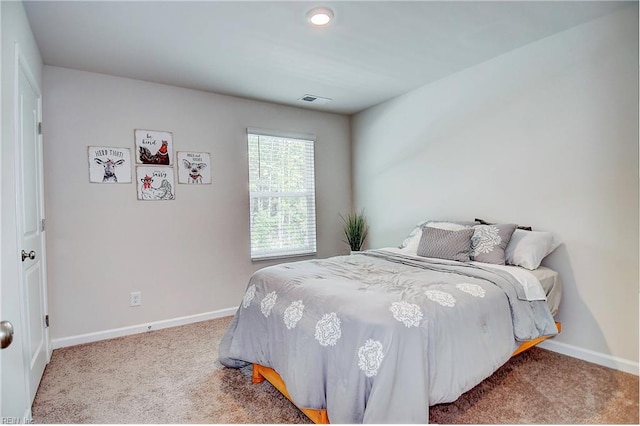 bedroom with light colored carpet