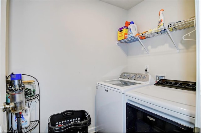 laundry room featuring laundry area and washing machine and clothes dryer