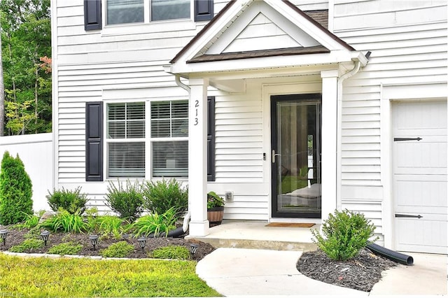 doorway to property featuring a garage