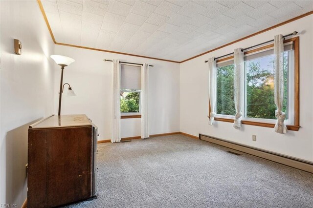 unfurnished bedroom with carpet flooring, baseboard heating, and ornamental molding