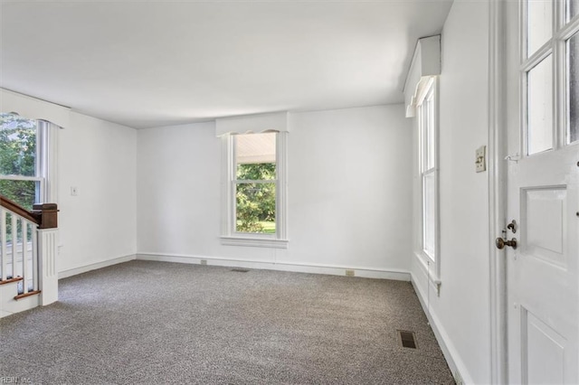 spare room featuring carpet flooring