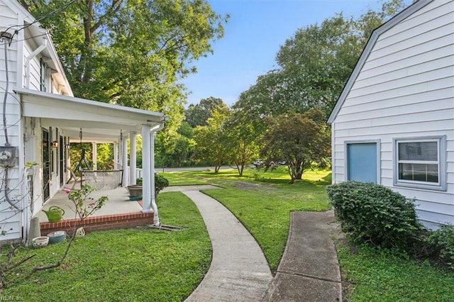 view of yard with a porch