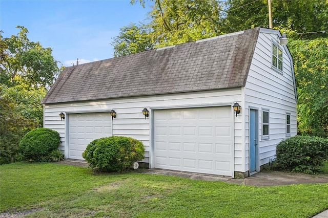 garage featuring a yard