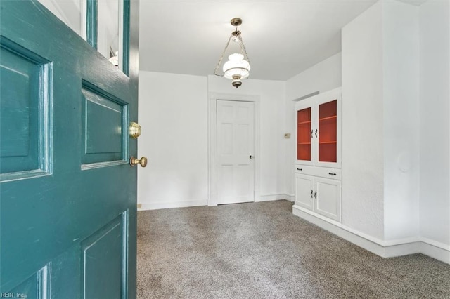 view of carpeted entrance foyer