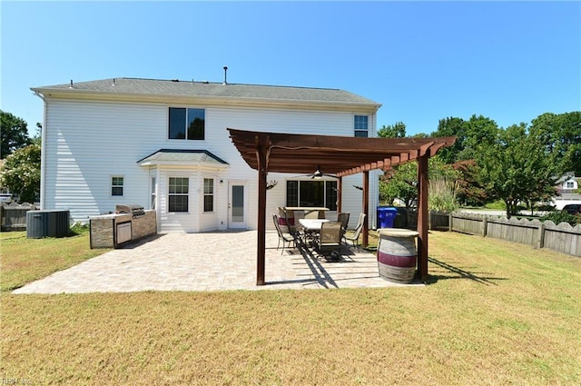 rear view of property featuring a pergola, central air condition unit, a patio area, and a yard