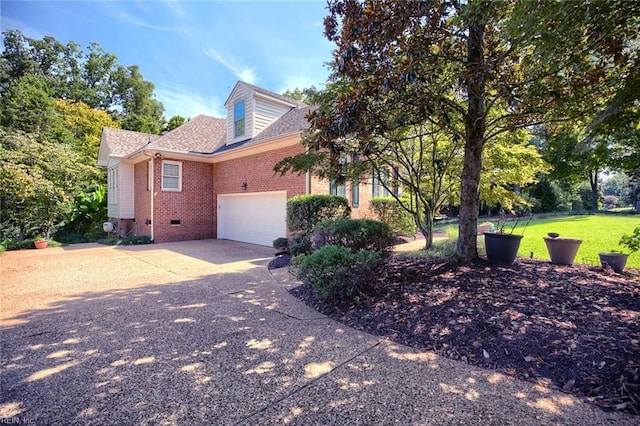 view of property exterior with a yard and a garage