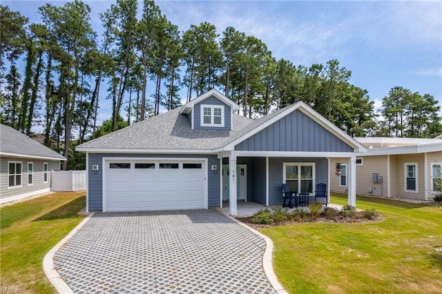 view of front of property with a porch and a front lawn