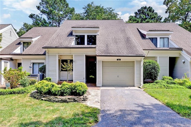 view of front of home featuring a garage and a front yard