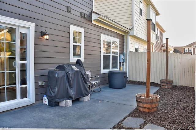 view of patio featuring fence and grilling area