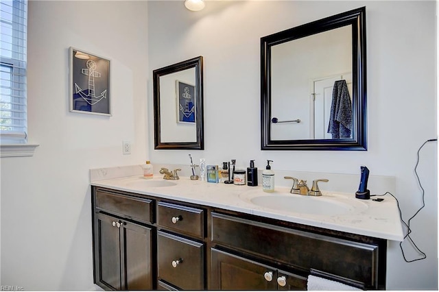 bathroom with double vanity and a sink