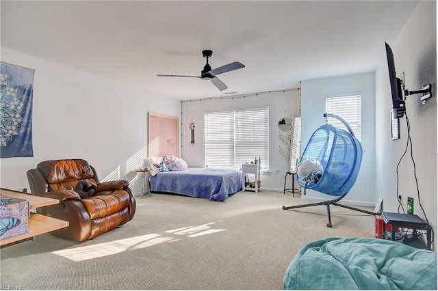 bedroom with carpet floors, ceiling fan, and baseboards