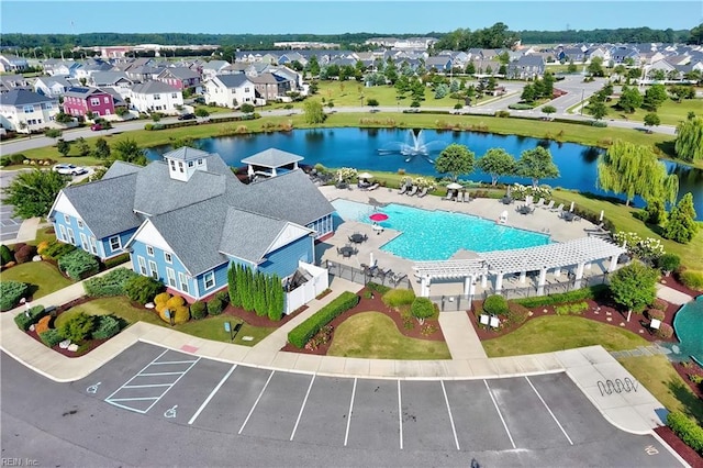 bird's eye view featuring a water view and a residential view