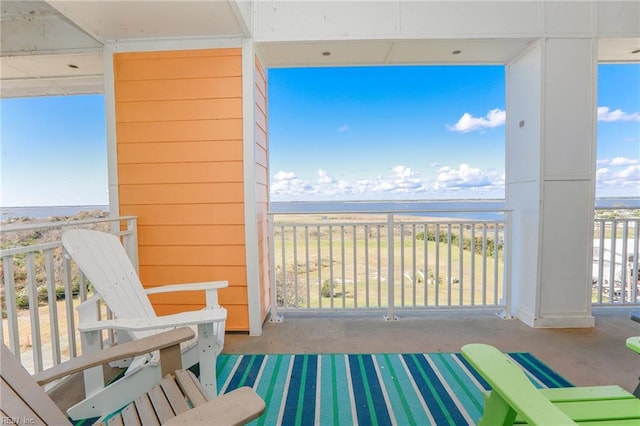 balcony featuring a water view