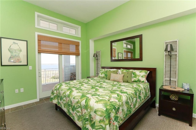 tiled bedroom featuring access to outside