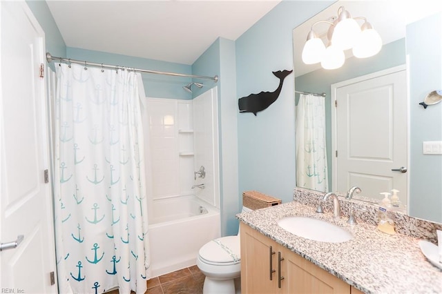 full bathroom with tile patterned floors, toilet, shower / bath combo with shower curtain, and vanity