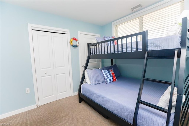 bedroom with a closet and carpet floors