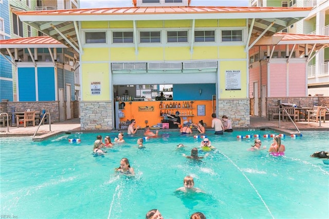 view of pool with pool water feature