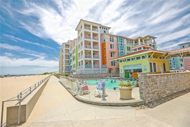 view of property featuring a community pool