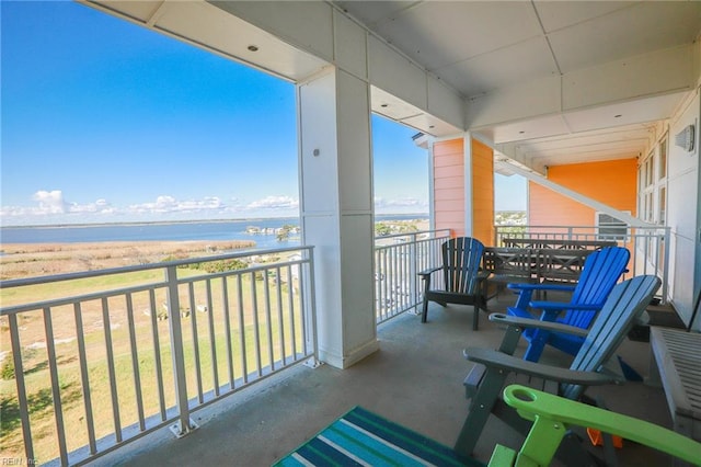 balcony featuring a water view