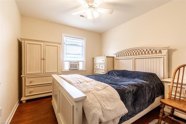 bedroom featuring dark wood-type flooring, ceiling fan, and cooling unit