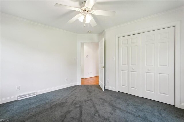 bathroom featuring crown molding, vanity, toilet, and tiled shower