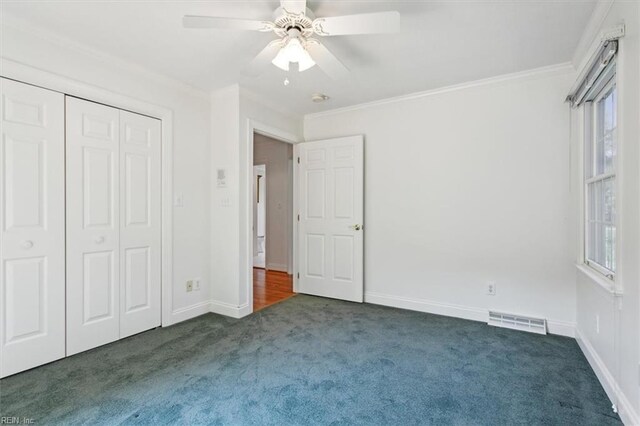 basement featuring ceiling fan and carpet flooring