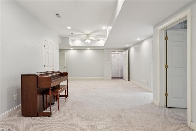 interior space featuring recessed lighting, light colored carpet, visible vents, and baseboards